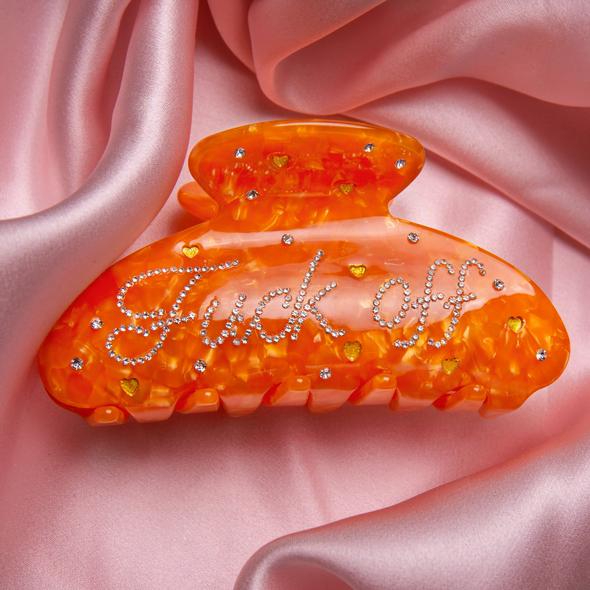 Oransje hårklype med krystaller