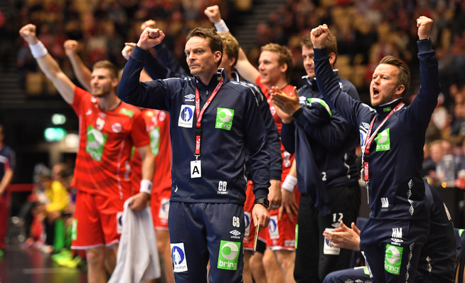 cheered FINALLY: Christian Berge (center) and Norway took a recipe statistics win against Bahrain.